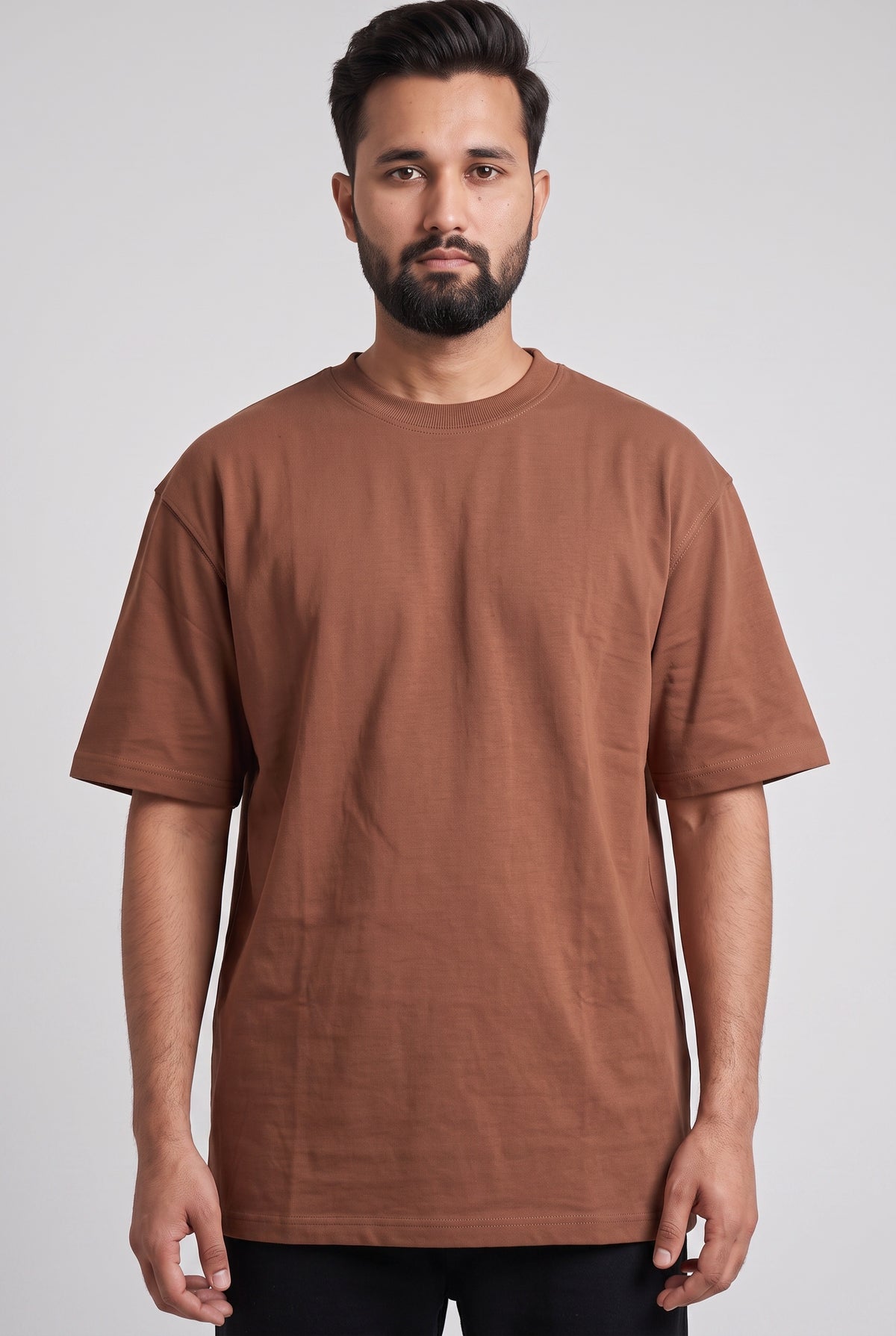 Front view of model wearing Zuke Lifestyle Rust Brown heavy cotton drop shoulder oversized t-shirt