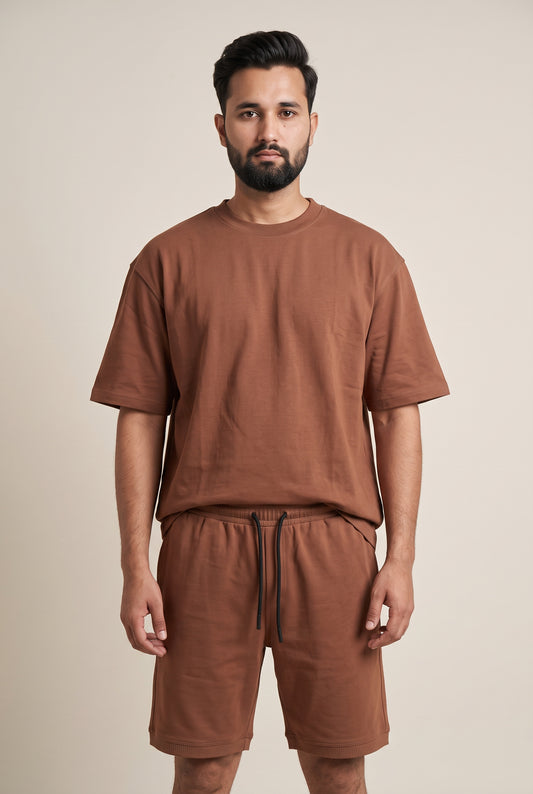 Front view of model wearing Zuke Lifestyle Rusty Brown Graphic heavy cotton drop shoulder oversized t-shirt