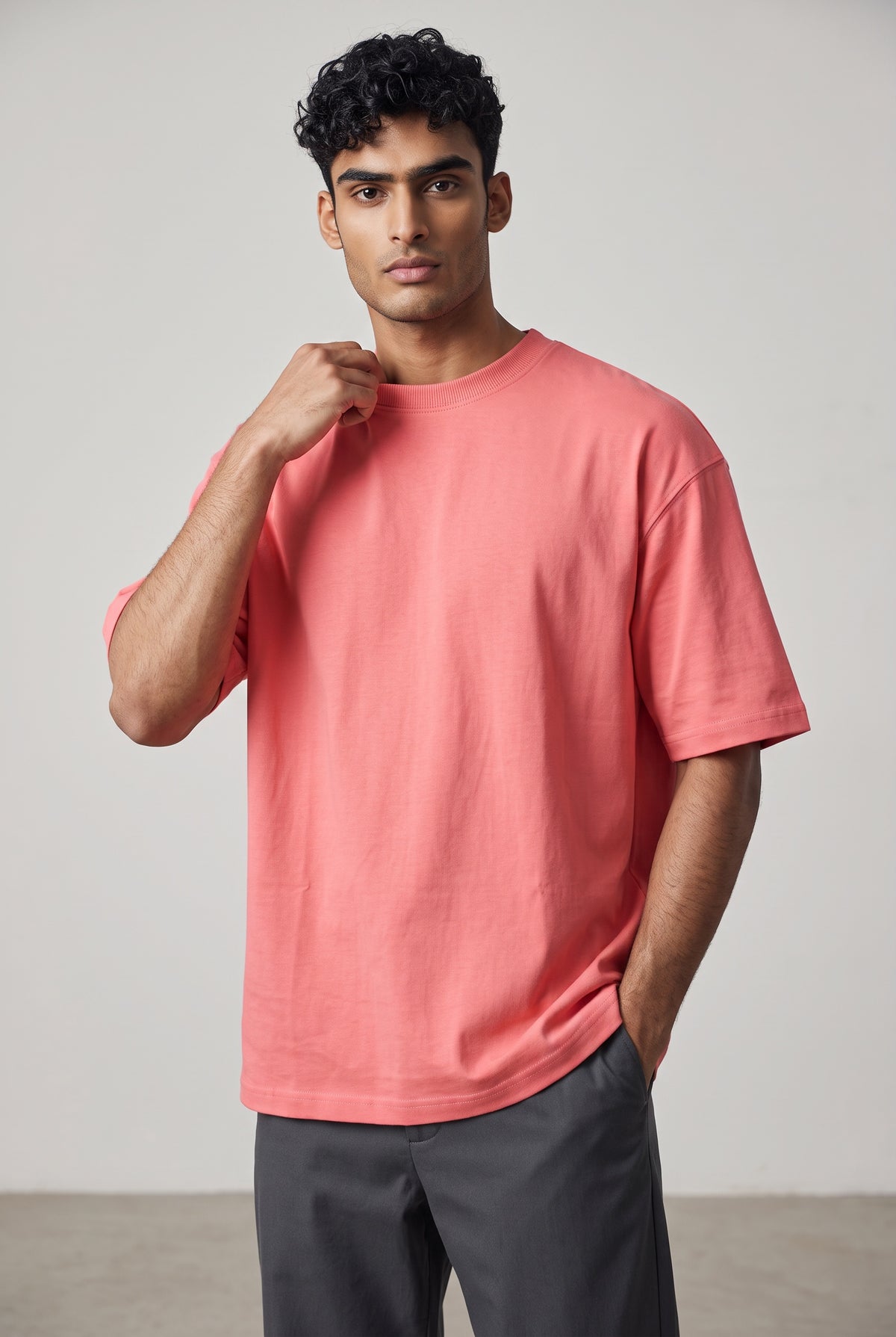 Front view of model wearing Zuke Lifestyle Salmon Pink heavy cotton drop shoulder oversized t-shirt